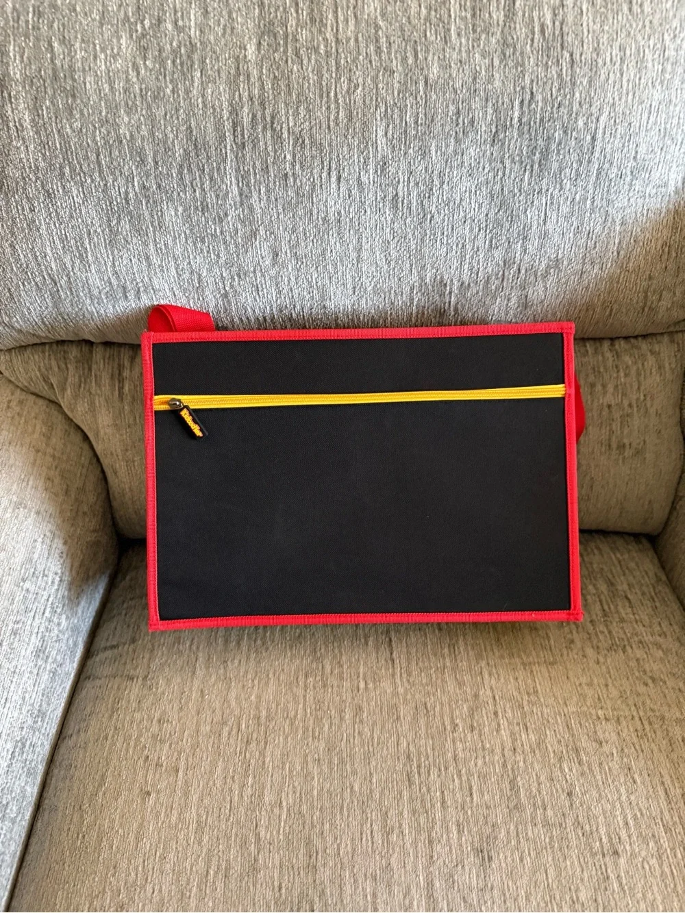 Kids travel activity organizer features a fold-out flat play surface. See detail